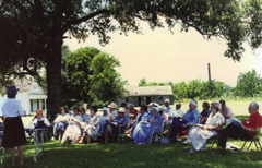 Descendants gather for a meeting on the lawn