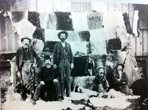 Col. Black (standing in the center) with a selection of the quality of hides from his tannery in Fort McKavett.
