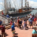 People boarding sailing ship, Elissa, in Galveston. 