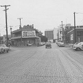 South Laredo Street at South Santa Rosa Street, May 1962. Casa Navarro and the new Bexar County jail are visible in the background. Photo courtesy of UTSA Special Collections.