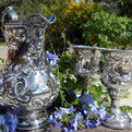 Silver pitcher and goblets.