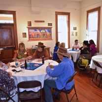Volunteers enjoying a meal at the Magoffin Home Visitor Center.