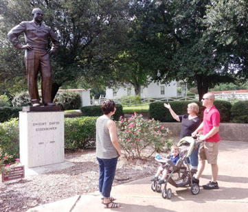 Visitors view the Eisenhower statue.