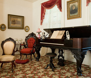 Interior room with grand piano.