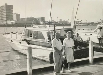 The Connors Family yacht; a high end small yacht, with a woman and her daughter posed in front