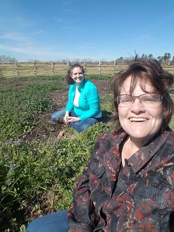 Picture of two women in a field 