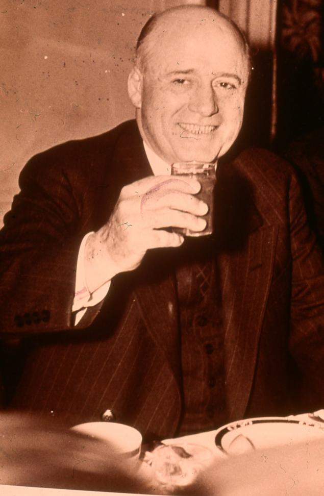 Picture of a man holding a glass 