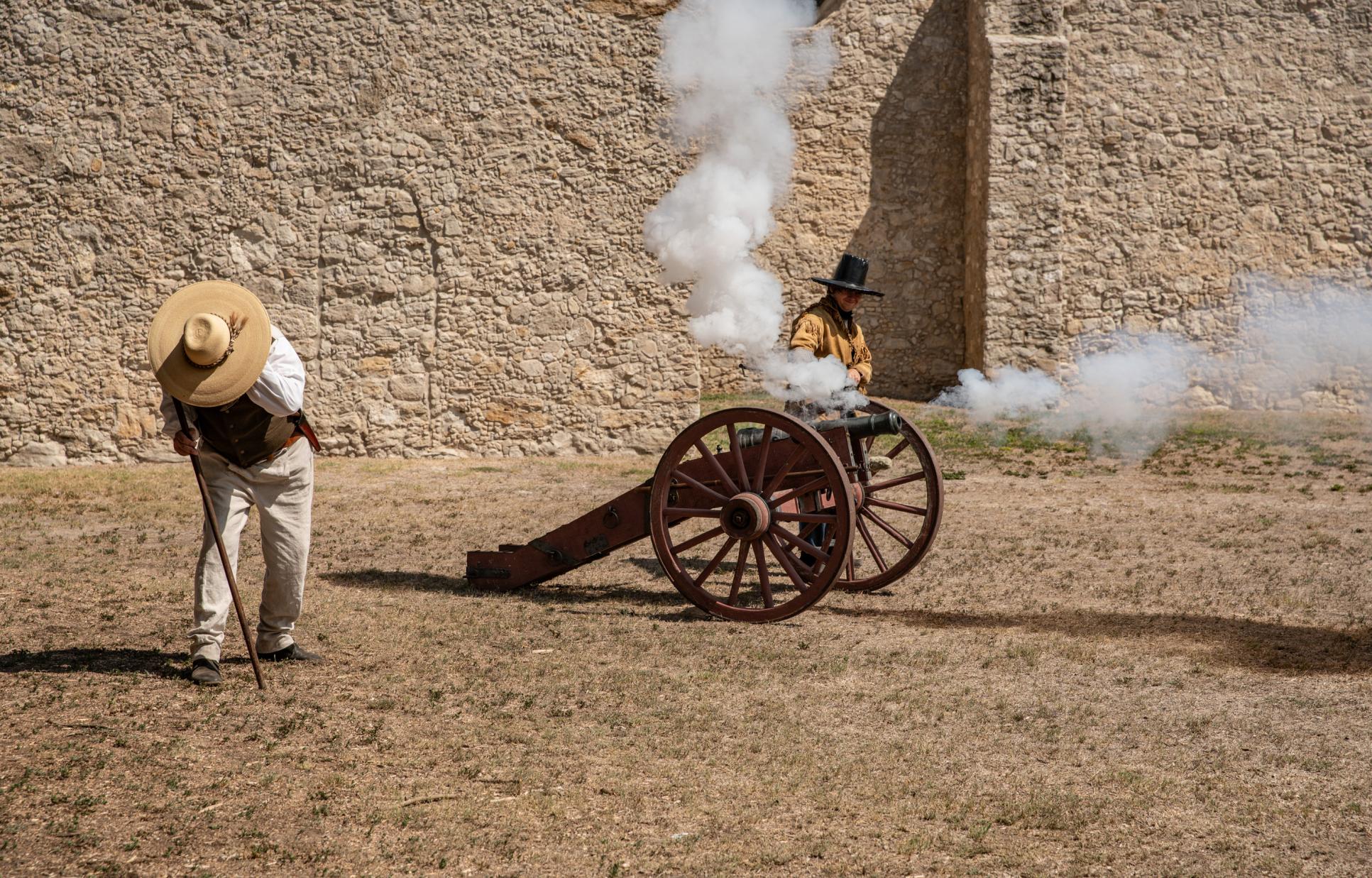 Reenactors firing a canon at Presidio la Bahia